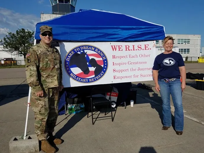 People In Front of Banner