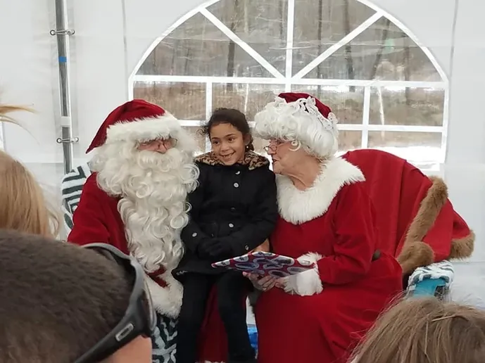 Child with Santa and Mrs. Claus